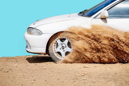 Rally racing car on dirt track.