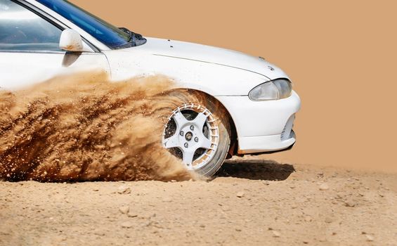 Rally racing car on dirt track.