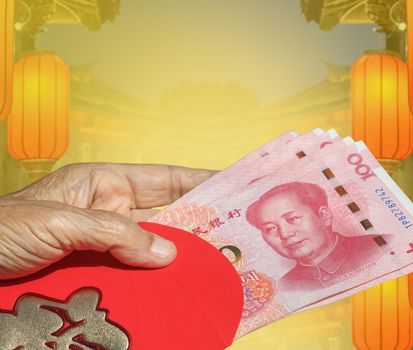 Grandmother holding red envelope chinese new year or hongbao , text on envelope meaning good luck