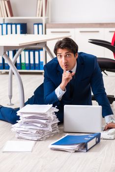 Tired exhausted businessman working overtime in office