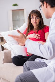 Pregnant woman patient visiting doctor for regular check-up