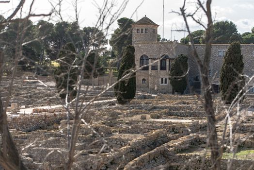Ruins of Ampuries, La Escala behind the ruins of Empuries, in the Province of Giron, Catalonia, Spain.