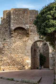 SANT MARTI D'EMPÚRIES, GIRONA, SPAIN: 2020 FEBRUARY 8: SUNNY DAY IN THE OLD CITY OF SANT MARTI DE AMPURIES, GIRONA, SPAIN