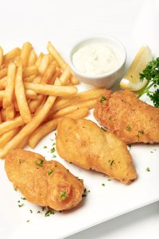 british traditional fish and chips meal on white plate