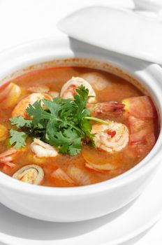 thai tom yum kung spicy and sour shrimp soup on white table background in phuket thailand