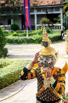 performer with traditional Lakhon Khol mask dance ceremony costume at Wat Svay Andet UNESCO Intangible Cultural Heritage site in Kandal province Cambodia