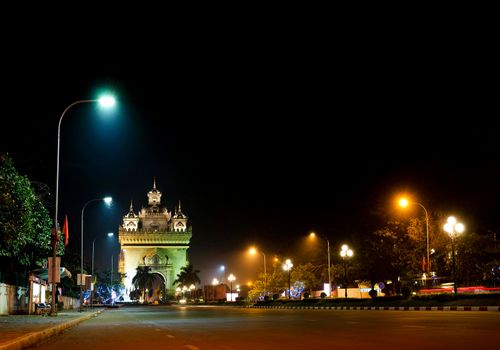 patuxai arch independence monument landmark in central avenue of vientiane city laos at night 
