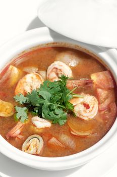 thai tom yum kung spicy and sour shrimp soup on white table background in phuket thailand