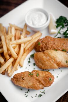 british traditional fish and chips meal on plate
