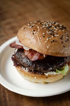 australian organic beef burger with bacon on wood table background