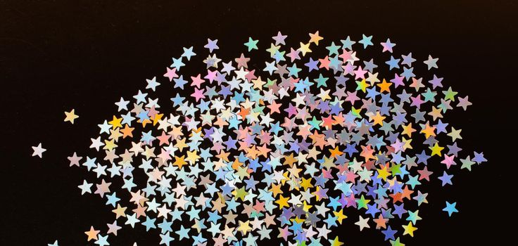 Colorful confetti  stars on a dark background