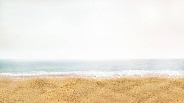 Blurring the background of a sandy beach in the vicinity of the sea
