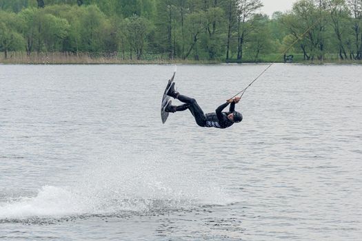 Belarus, Minsk - May 16, 2021: Sports. Kitesurfer jumping over the water. Stock photography.