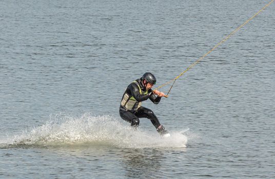 Spain, Tenerife Island - May 28, 2021: Sports. The kitesurfer sat down on the board. Stock photography.