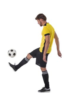 Soccer player is kicking ball isolated on white background