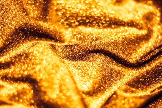 Luxe glowing texture, night club branding and New Years party concept - Golden holiday sparkling glitter abstract background, luxury shiny fabric material for glamour design and festive invitation