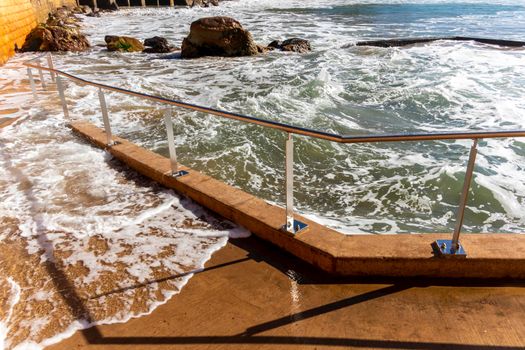 Photograph of the Rock Pool in the Pacific Ocean at Terrigal Beach at sunset on the Central Coast in New South Wales in Australia