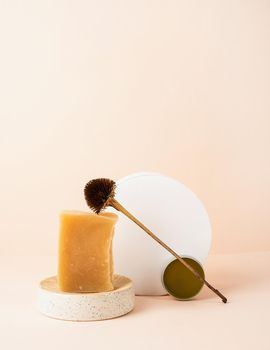 Natural cosmetics.Creative art composition with soap and balsam, natural cosmetics on beige background with copy space