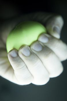 Exercises with one hand and yellow physiotherapy ball