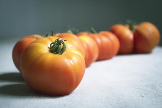 Group of uncooked raw red tomatoes. Raw food