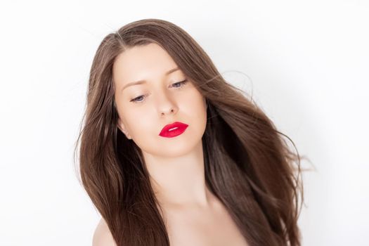 Beautiful woman with healthy gorgeous long hair, natural brunette hairstyle and red lipstick makeup, haircare and beauty ad.