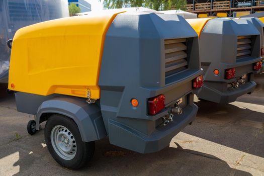 Mobile diesel compressor on wheels for supplying pneumatic air to devices.