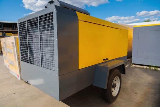 Mobile diesel compressor on wheels for supplying pneumatic air to devices.
