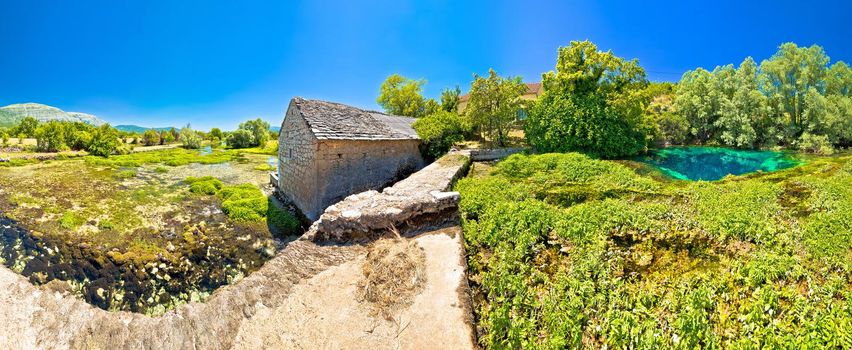 Old stone mill ruins on Cetina river source panoramic view, Dalmatian Zagora region of Croatia