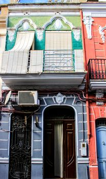 Colorful facades of old buildings in The Cabanyal neighborhood in Valencia, Spain
