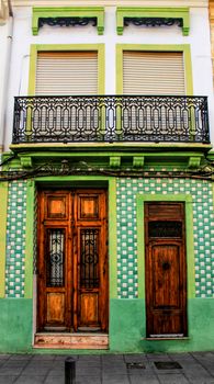 Colorful facades of old buildings in The Cabanyal neighborhood in Valencia, Spain