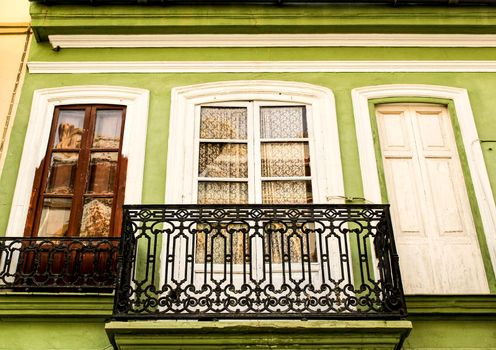 Colorful facades of old buildings in The Cabanyal neighborhood in Valencia, Spain