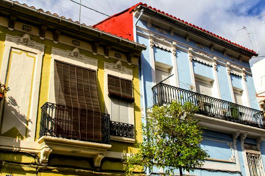 Colorful facades of old buildings in The Cabanyal neighborhood in Valencia, Spain