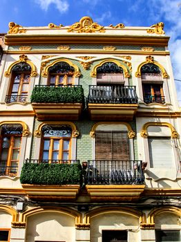 Colorful facades of old buildings in The Cabanyal neighborhood in Valencia, Spain