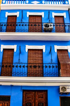 Colorful facades of old buildings in The Cabanyal neighborhood in Valencia, Spain