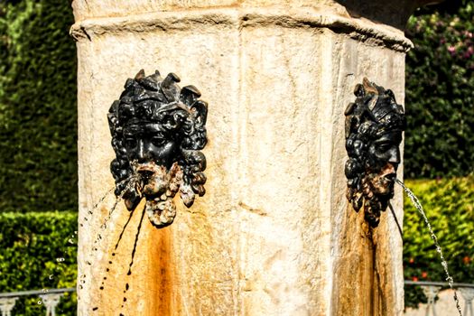 Rusty and vintage fountain in the garden
