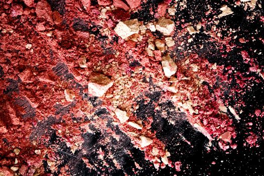 Crushed cosmetics, mineral organic eyeshadow, blush and cosmetic powder isolated on black background, makeup and beauty banner, flatlay design.