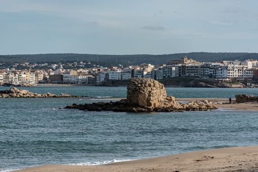 Grec Wall in Platja de Les Muscleres in La Escala behind the ruins of Empuries, in the Province of Giron, Catalonia, Spain.