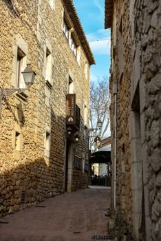 SANT MARTI D'EMPÚRIES, GIRONA, SPAIN: 2020 FEBRUARY 8: SUNNY DAY IN THE OLD CITY OF SANT MARTI DE AMPURIES, GIRONA, SPAIN