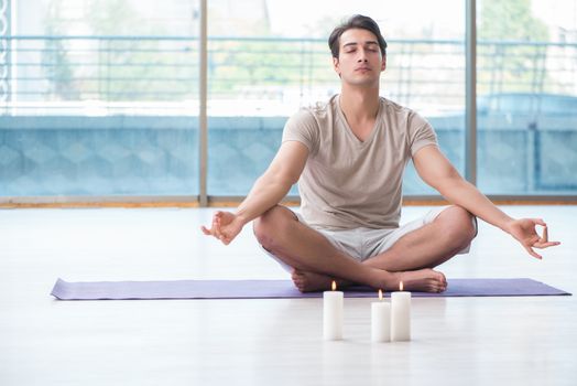 Young handsome man in spa healthcare concept