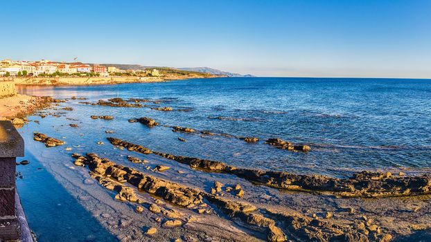 Panoramic view at sunset from the historic ramparts, one of the main sightseeing in Alghero, famous center and holiday resort in northwestern Sardinia, Italy