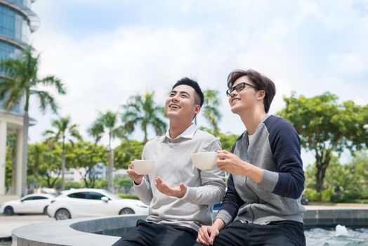 Two businessman having a casual meeting or discussion in the city.