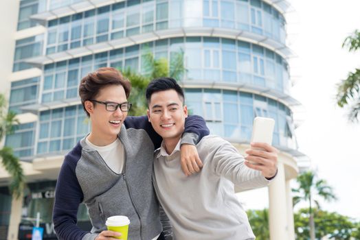 Two young man video call using smartphone