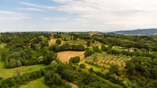 A stunning aerial view of the Tuscan countryside with its characteristic spring colors.