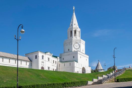 Kazan, Russia - May 19, 2021. View of the ancient historical Spasskaya tower and the wall of the Kazan Kremlin. Selective focus.