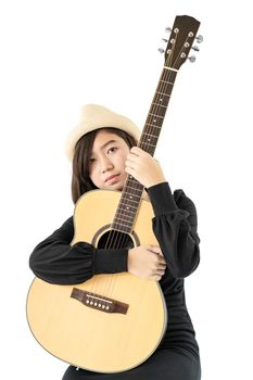 Young asia woman hold guitar guitar folk song in her hand isolate on white background