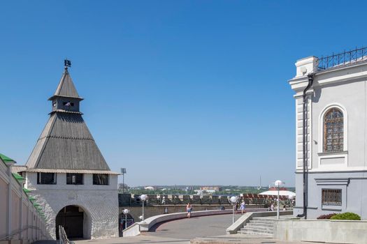 Kazan, Russia - May 19, 2021. View of the ancient historical Spasskaya tower and the wall of the Kazan Kremlin. Selective focus.