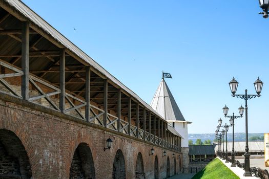 Kazan, Russia - May 19, 2021. A perspective fragment of the fortress defensive wall of the ancient Kazan Kremlin. Historical heritage. Selective focus.