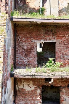 A destroyed brick building on the territory of the Oreshek fortress, red brick ruins