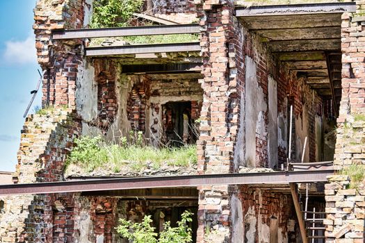 A destroyed brick building on the territory of the Oreshek fortress, red brick ruins