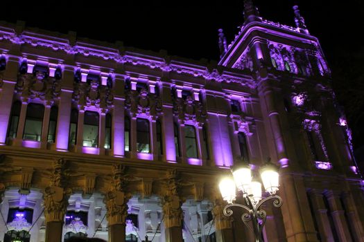 Beautiful City Hall of Madrid illuminated in purple in the International Women's Day